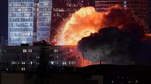 An explosion is seen during a missile attack in Tel Aviv, Israel