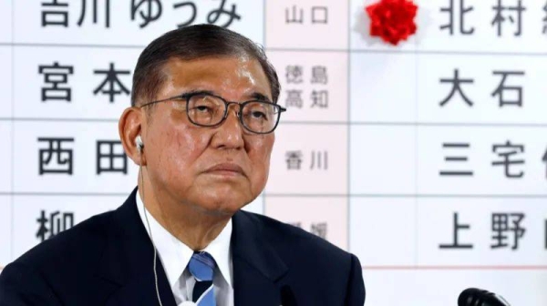 Shigeru Ishiba took questions from journalists at his party's Tokyo headquarters in the hours after the polls closed