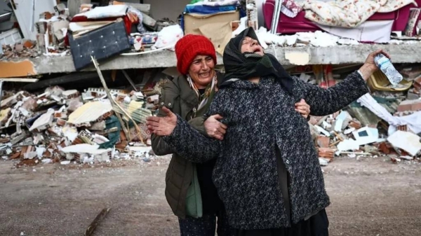 Women react at the site of a collapsed building in the aftermath of a major earthquake in the Elbistan district of Kahramanmaras in Turkey.