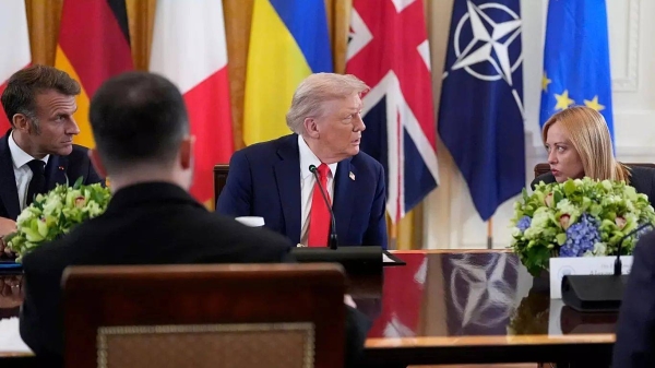 US President Donald Trump, center, speaks with Italy's Prime Minister Giorgia Meloni, right, and France's President Emmanuel Macron, left at the White House on  Monday
