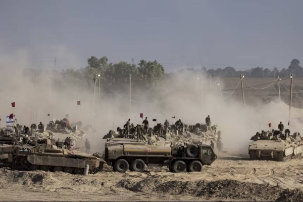 Israeli troops are seen near the border with Gaza on August 6.