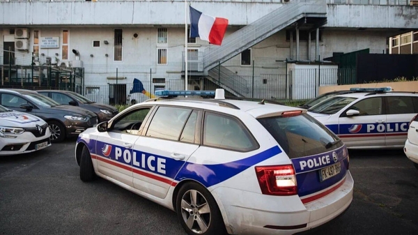 A police car arrives at the police station in the Paris suburb of Sarcelles