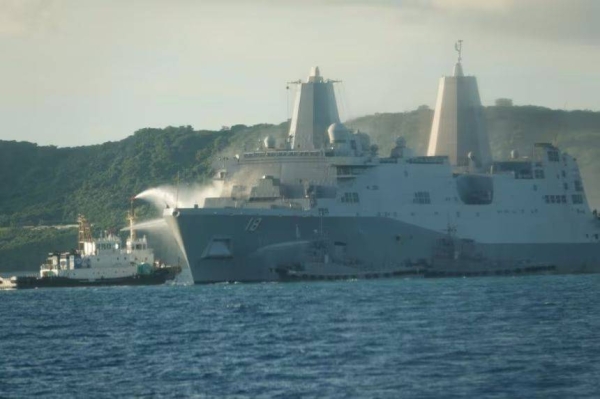 A photo provided by the Japanese Coast Guard shows crews battling the fire on the USS New Orlenas
