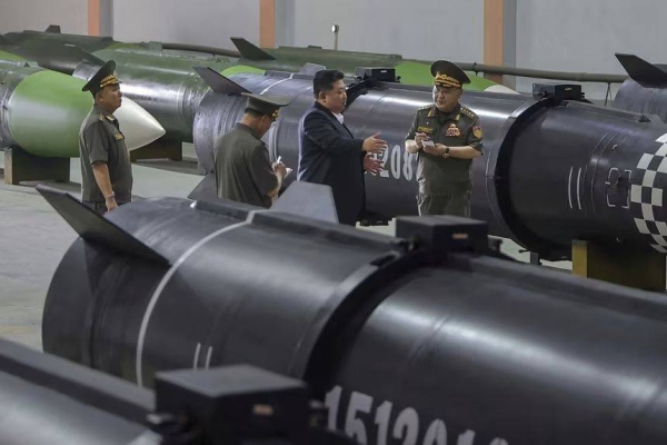North Korean leader Kim Jong Un inspects a missile production line in an undisclosed location on August 31, 2025