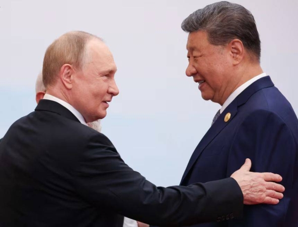 Russia's President Vladimir Putin speaks with Chinese leader Xi Jinping during the Shanghai Cooperation Organisation (SCO) Summit in Tianjin, China on September 1, 2025