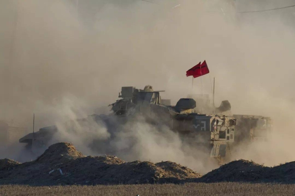 Israeli soldiers move armoured personnel carriers near the Israeli-Gaza border, 2 September, 2025
