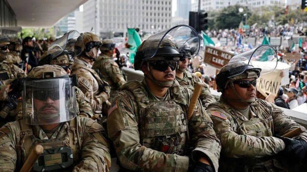 California National Guard soldiers stand guard at a federal building on 14 June 2025 in Los Angeles, California