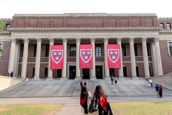 Harvard University students with graduation gowns at the Widener Library on the Harvard Campus in Cambridge, Massachusetts on Wednesday, June 4, 2025