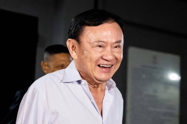 Thailand's former Prime Minister Thaksin Shinawatra leaves the Pheu Thai Party headquarters in Bangkok on August 29, 2025