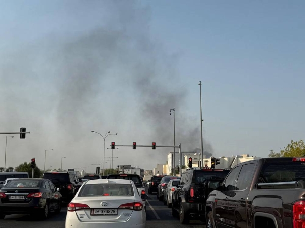 Smoke rises after several blasts were heard in Doha, Qatar, on Tuesday