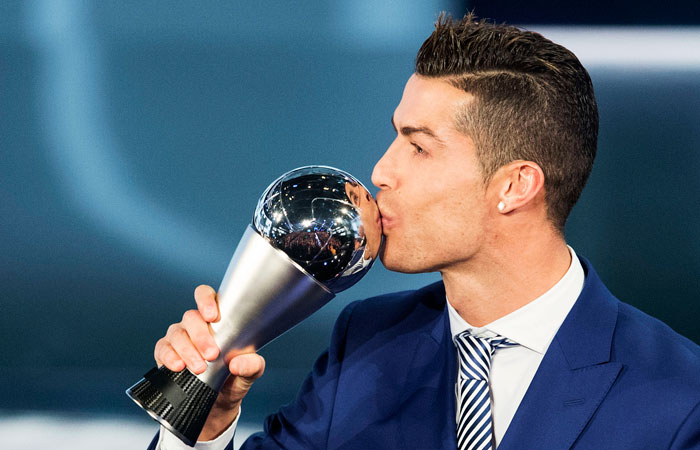 Portugal's Cristiano Ronaldo, who plays for Real Madrid, kisses the trophy after winning The Best FIFA Men's Player award during the The Best FIFA Football Awards 2016 ceremony held at the Swiss TV studio in Zurich, Switzerland, Monday. — AP