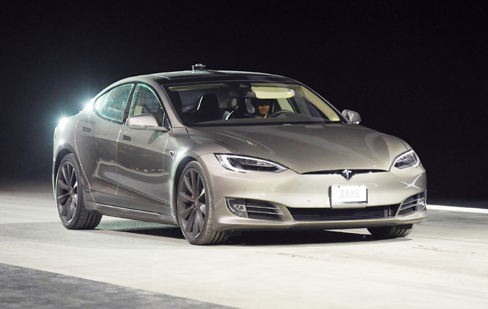 A Tesla Model S P100D in ludicrous mode is shown during a speed test against Faraday Future's FF 91 prototype at The Pavilions at Las Vegas Market on Jan. 3, 2017 in Las Vegas, Nevada