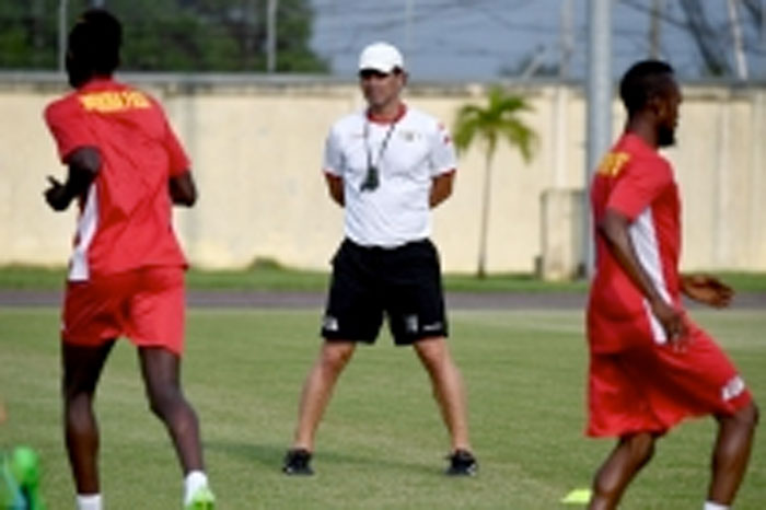 Burkina Faso coach Paulo Duarte looks at his players during a training session in Libreville Thursday during the 2017 Africa Cup of Nations football tournament in Gabon. - AFP