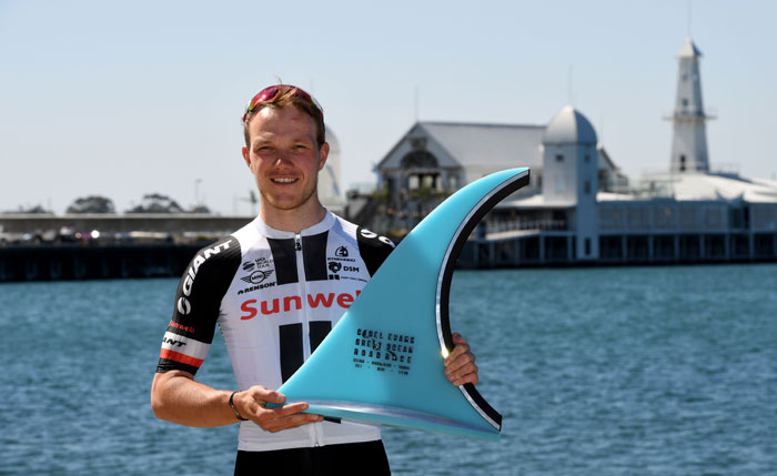Germany’s Nikias Arndt of Team Sunweb poses with the trophy after winning the Cadel Evan Great Ocean Road Race cycling event in Geelong on Sunday. — AFP