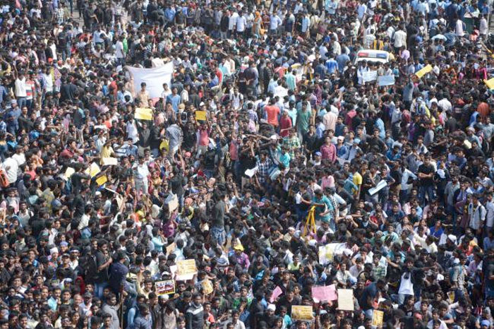 Indian protesters gather during a demonstration against the ban on the Jallikattu bull taming ritual at Marina Beach at Chennai. — AFP