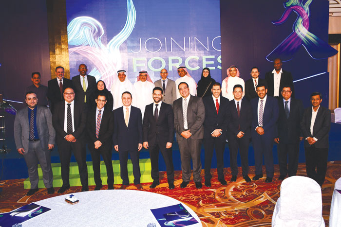 Saudi medical practitioners specialized in oncology discipline and doctors from Pfizer Saudi Arabia pose for a group photo during a symposium on the new medicine