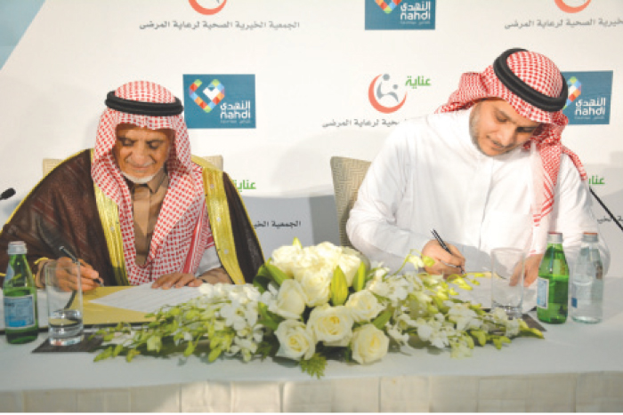 Dr. Abdulrahman bin Abdulaziz Al Swailem and Engineer Yasser Joharji sign the MoU