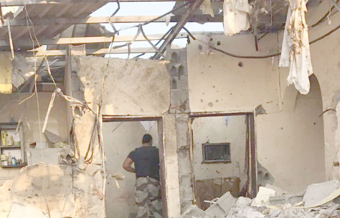 The damaged ceiling of a rest house in Al-Harazat district as two terror suspects blew themselves up.