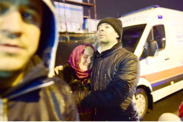 People react at the site of the armed attack in Istanbul, Sunday. — AFP