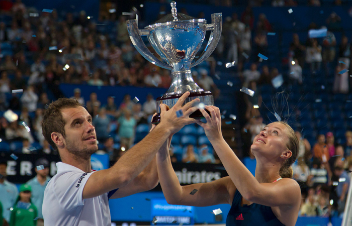 Richard Gasquet (L) and Kristina Mladenovic of France celebrate with their trophy after defeating Coco Vandeweghe and Jack Sock of the US in the mixed doubles final of the Hopman Cup Tennis Tournament in Perth Saturday. — AFP