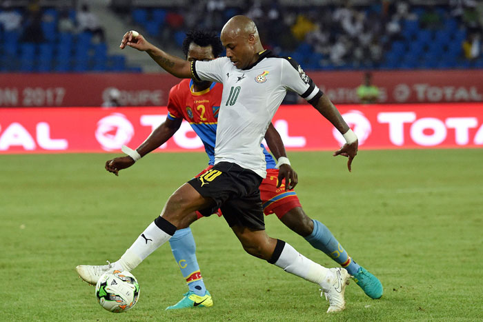 Ghana's forward Andre Ayew challenges Democratic Republic of the Congo's defender Issama Mpeko (back) during the Africa Cup of Nations quarterfinal in Oyem on Sunday. — AFP