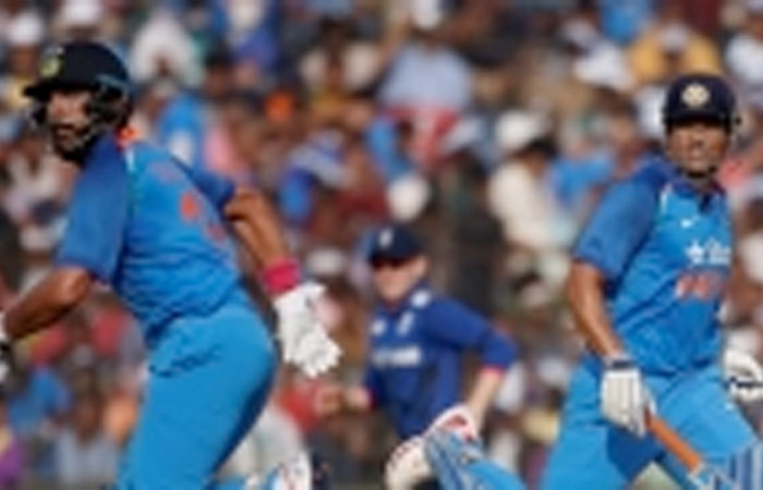 India’s Mahendra Singh Dhoni and Yuvraj Singh run between the wickets during their ODI match against England in Cuttack Thursday. - Reuters