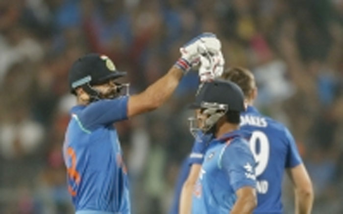 India’s Kedar Jadhav (R) celebrates with captain Virat Kohli his hundred runs against England during their first ODI match in Pune, India, Sunday. - AP