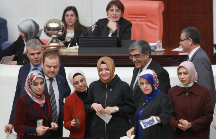 Lawmakers cast their votes during the second round of debate in the proposed changes to the Turkish constitution, at the Turkish parliament in Ankara on Saturday. — AFP