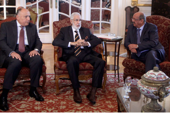 (From L to R) Egyptian Foreign Minister Sameh Shoukry, Libyan foreign minister in the government of national reconciliation, Mohamed Tahar Siala, and Algerian Minister of Maghreb Affairs, Abdelkader Messahel, chat in Cairo on Saturday during a meeting over the political and economical turmoil in Libya. — AFP