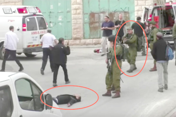 A scene from a video shows Sergeant Elor Azaria raising his gun at the wounded Palestinian. — File photo