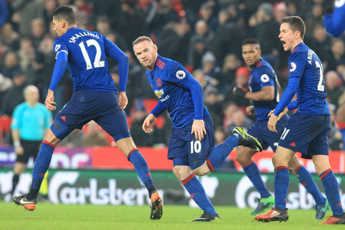 Manchester United's English striker Wayne Rooney (C) celebrates scoring his 250th goal to make him the club's all-time record goal scorer in the English Premier League football match between Stoke City and Manchester United at the Bet365 Stadium in Stoke-on-Trent, central England on  Saturday. — AFP .
