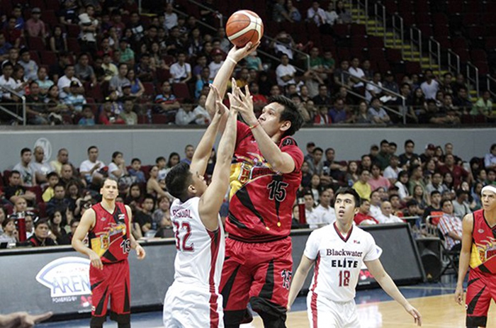 San Miguel Beer's June Mar Fajardo scores easily as he towers over Blackwater's Kyle Pascual in their PBA Philippine Cup game at the Mall of Asia Arena Friday night.