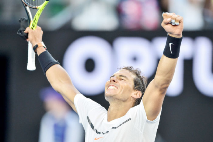 Spain’s Rafael Nadal celebrates after victory against Germany’s Alexander Zverev during their men’s singles third round match on day six of the Australian Open tennis tournament in Melbourne on Saturday. — AFP