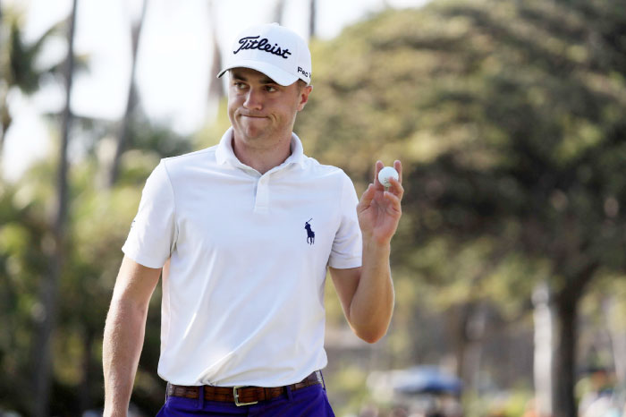 Justin Thomas of the United States reacts after putting for par on the ninth green during the second round of the Sony Open In Hawaii Friday. - AFP