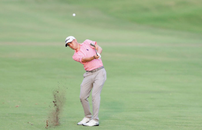 Justin Thomas of the United States plays a shot on the 18th hole during the third round of the Sony Open in Hawaii Saturday. — AFP