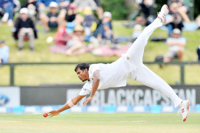 Bangladesh’s Rubel Hossain attempts to catch New Zealand’s Ross Taylor during day two of the second international Test cricket match between New Zealand and Bangladesh at Hagley Park Oval in Christchurch on Sayurday. — AFP