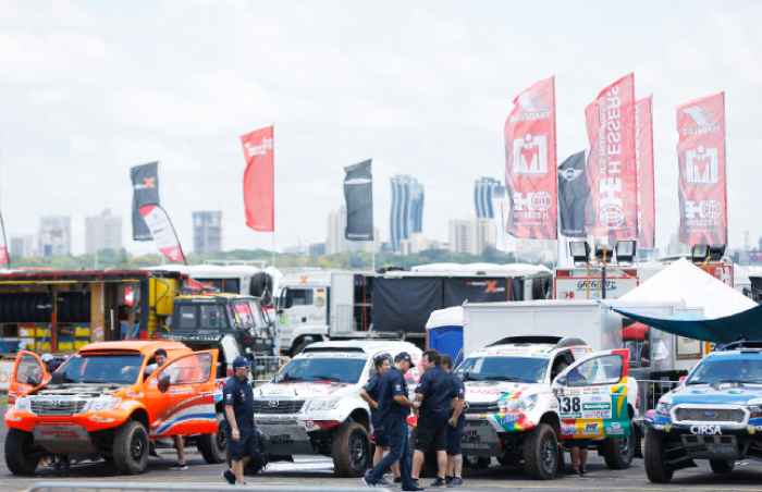Cars wait for a technical inspection in Luque, Paraguay, Saturday. — AP