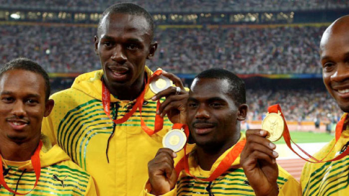Jamaican sprint superstar Usain Bolt along with the winning relay team in this file picture.