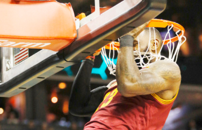 Cleveland Cavaliers’ forward LeBron James does a pull-up on the rim before the start of the game against Charlotte Hornets in Charlotte, N.C., Saturday. — AP