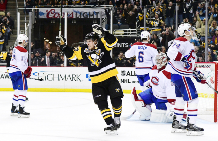 Sidney Crosby of the Pittsburgh Penguins celebrates during their NHL game against the Montreal Canadiens at PPG Paints Arena in Pittsburgh Saturday. — AFP