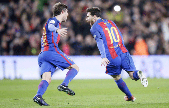 Barcelona’s Lionel Messi (R) reacts after scoring during a Copa del Rey match against Athletic Bilbao at the Camp Nou in Barcelona Wednesday. — AP