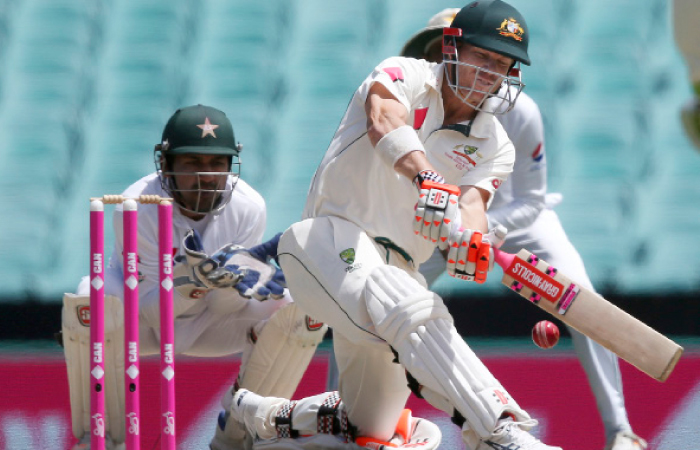 Australia’s David Warner drives the ball against Pakistan during their Test match in Sydney Friday. - AP