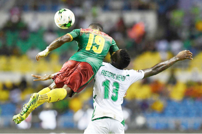 Cameroon’s defender Collins Fai (L) heads the ball with Guinea Bissau’s forward Frederic Mendy during their 2017 Africa Cup of Nations match in Libreville Wednesday. - AFP