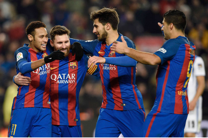 Barcelona’s forward Lionel Messi (2nd L) celebrates with teammates Neymar (L), Andre Gomes (2nd R) and Luis Suarez after scoring a goal during their Spanish Copa del Rey (King’s Cup) quarterfinal second leg match against Real Sociedad in Barcelona Thursday. - AFP