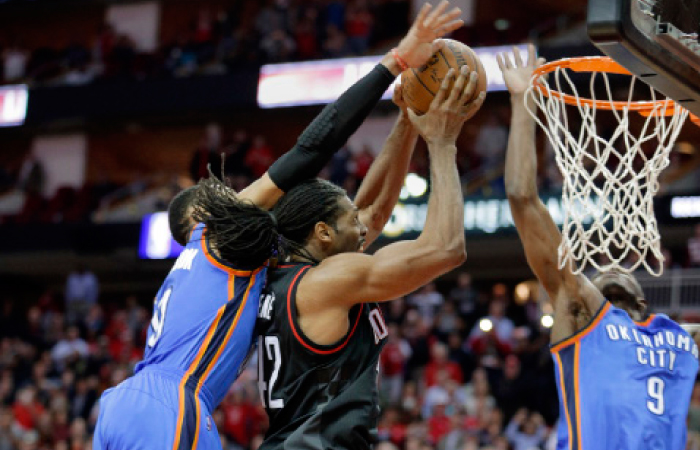 With the game tied at 116, Oklahoma City Thunder’s Russell Westbrook (L)  and Victor Oladipo (R) foul Houston Rockets’ Nene as he drives for a basket in the second half of their NBA basketball game in Houston Thursday. - AP