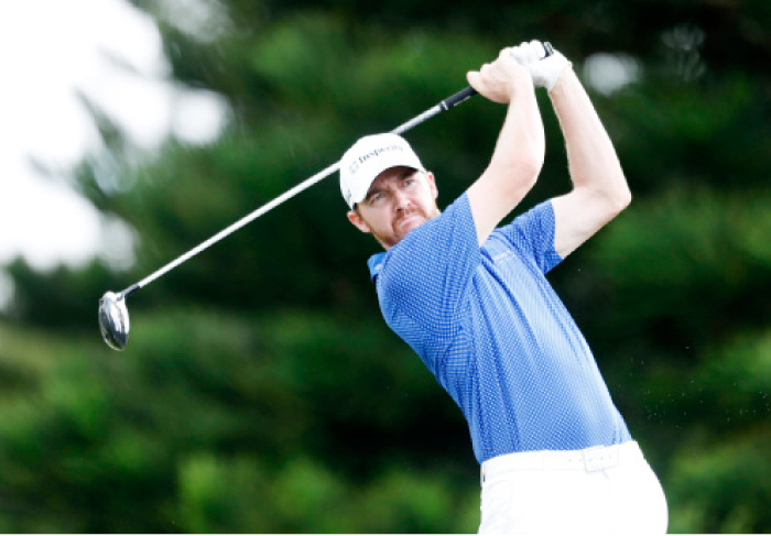 PGA golfer Jimmy Walker tees off on the 18th hole during the first round of the SBS Tournament of Champions at Kapalua Resort in Hawaii Thursday. — Reuters