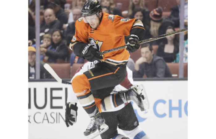 Anaheim Ducks’ Cam Fowler (Top) jumps to avoid a collision with Colorado Avalanche’s Gabriel Landeskog during the first period of their NHL game in Anaheim, California, Thursday. - AP