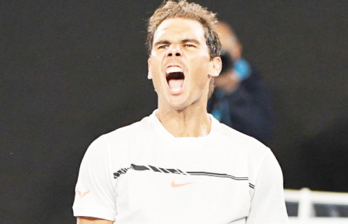 Spain’s Rafael Nadal celebrates his victory against Canada’s Milos Raonic in their men’s singles quarterfinal match of the Australian Open in Melbourne Wednesday. - AFP