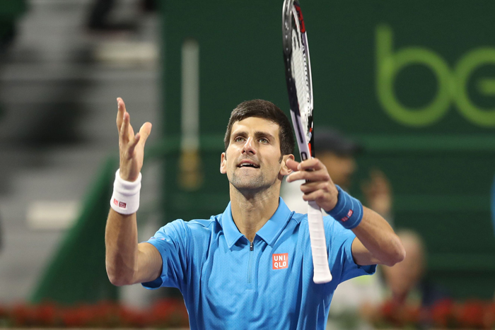 Serbia's Novak Djokovic celebrates after beating Spain's Fernando Verdasco in their semifinal match of the ATP Qatar Open in Doha Friday. — AFP