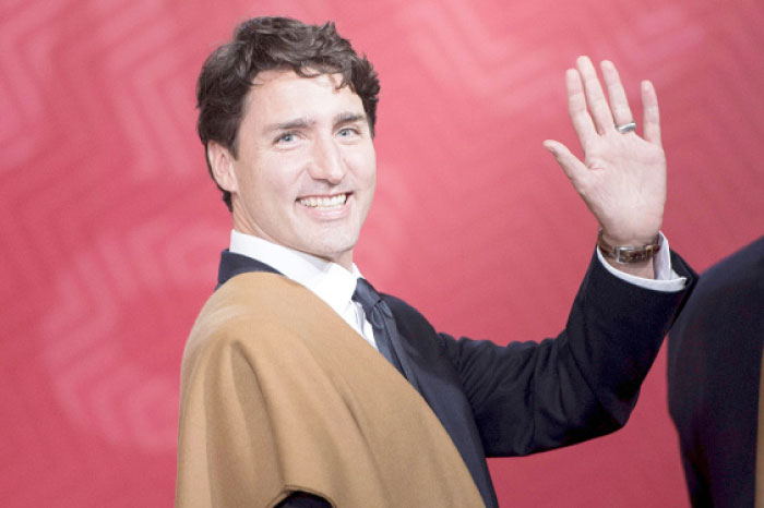 Canada’s Prime Minister Justin Trudeau waving during the traditional “family photo“ on the final day of the Asia-Pacific Economic Cooperation (APEC) Summit in Lima in this Nov. 20, 2016 file photo. — AP